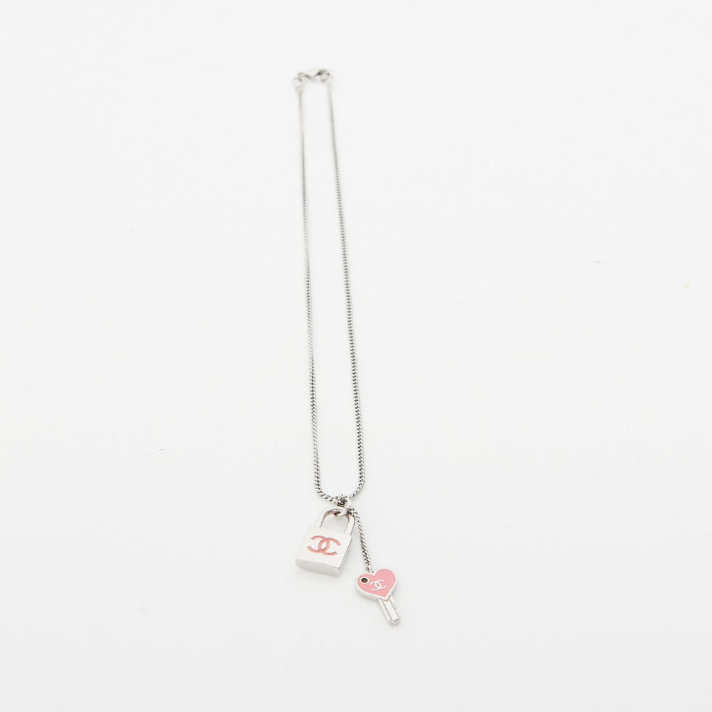 
            
                Load image into Gallery viewer, Chanel lock and key enamel necklace
            
        